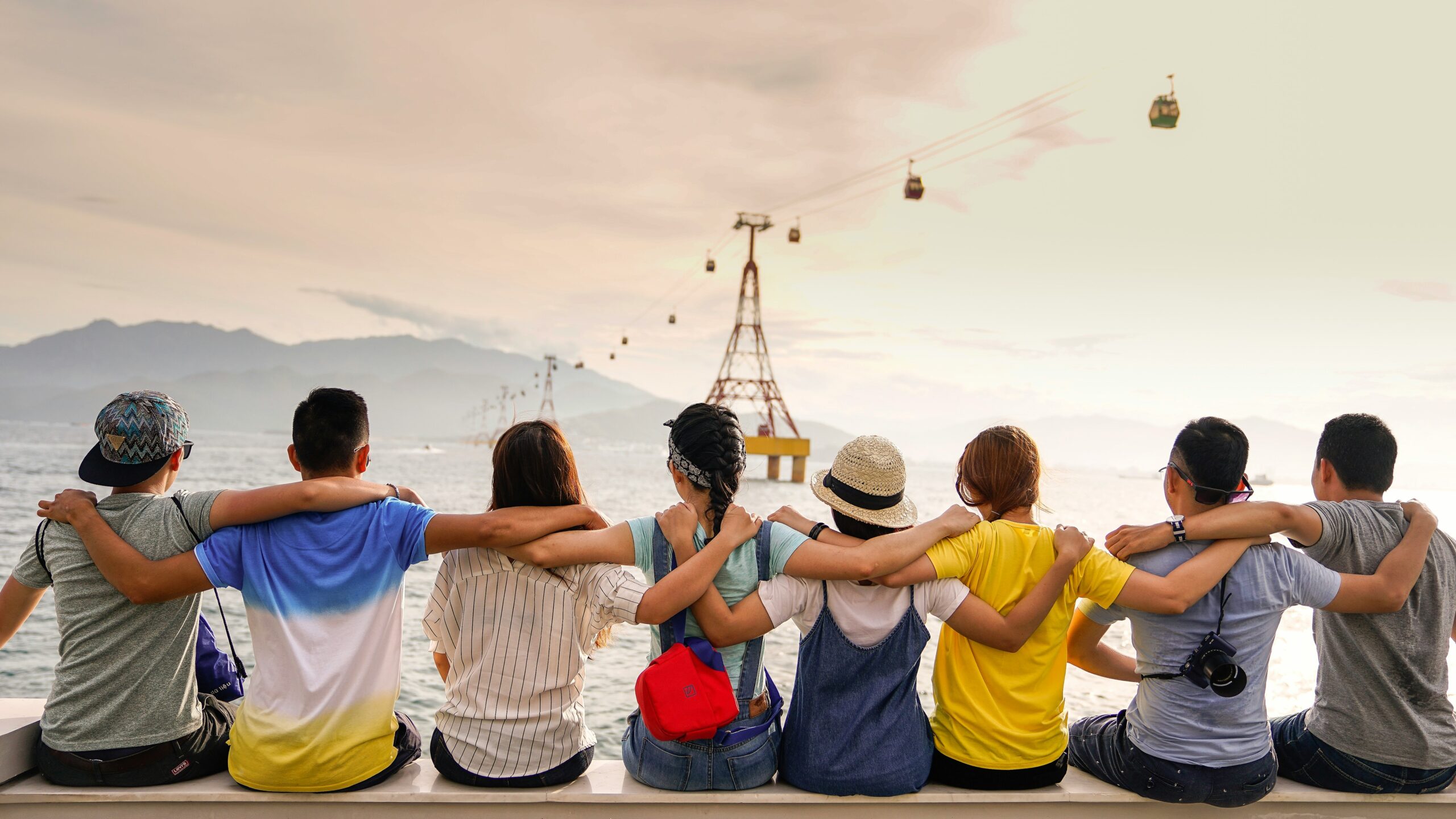“College students enjoying an industrial visit trip, standing together outdoors near a facility”